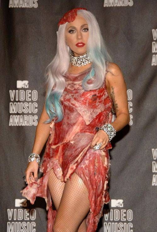 lady gaga meat dress real. Lady Gaga draped in meat dress